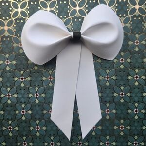 Elegant White Ivory Bow with Green Center
